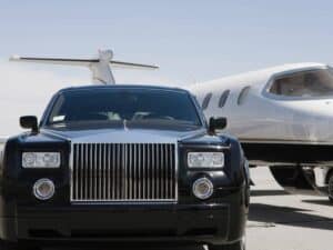 Private jet and luxury car ready for executive travel during peak flying seasons.